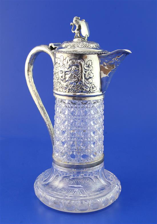 A late Victorian repousse silver mounted hobnail cut glass claret jug, 10.5in.